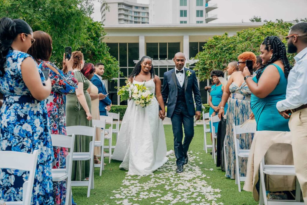elegant Tampa Florida wedding walking dow the aisle